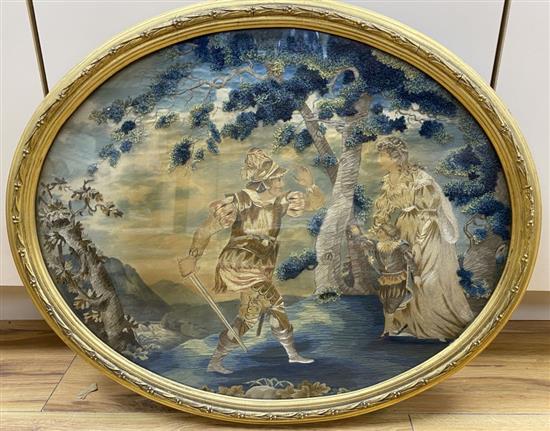 An early 19th century oval embroidered and coloured silk picture of a knight, his lady and son, gilt frame, W 54cm